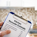 kitchen designer holding estimate on clipboard