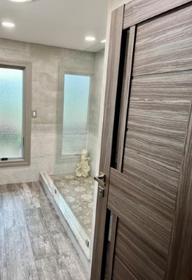 Laminate entrance door to remodeled bath