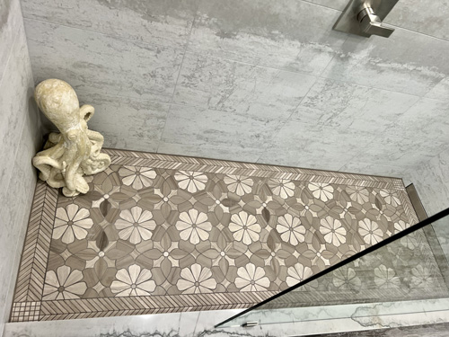 mosaic floor tile in step in shower