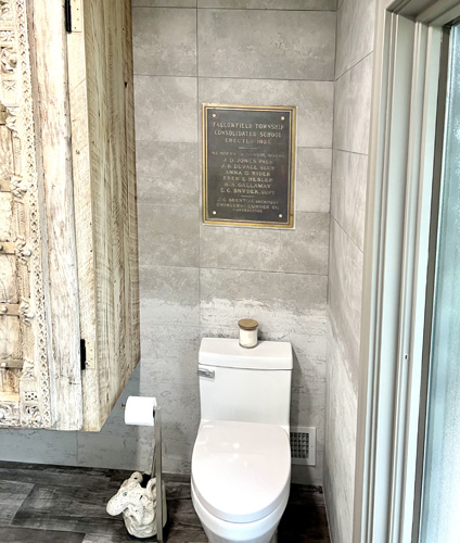 plaque installed over toilet
